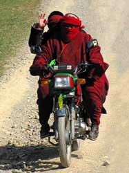 Motorcycle is the main mean of transportation in the mountains. It makes civilians here very mobile. Those guys on motorcycles passing by, often produce rather brigandish impression. But their outlook doesn't keep them from being quite friendly. Look at their long sleeves. They might be comfortable for carrying anything inside, but hardly for bicycling.