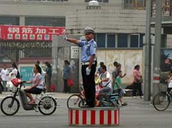 Chinese drivers are not used to respect road discipline. Even in big cities semaphores are ignored, unless a police officer appears in sight.